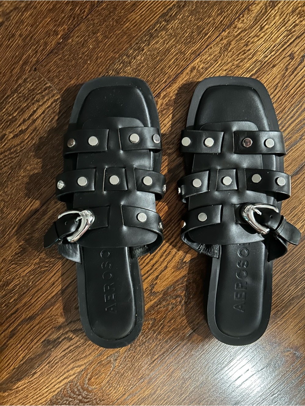 AEROSOLES Black Slide Sandals with Silver Buckle Accents